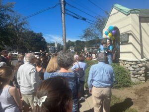 A crowd views people speaking