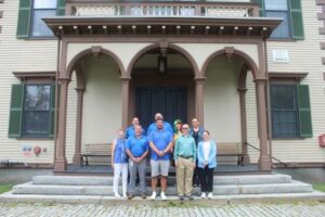 A group on the steps of the Acton Town Hall