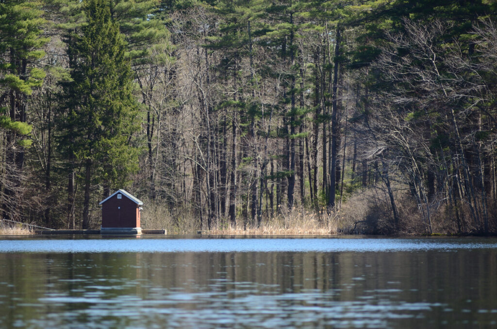 Photo of a water pumping station from opposite shore of Nagog Pond.