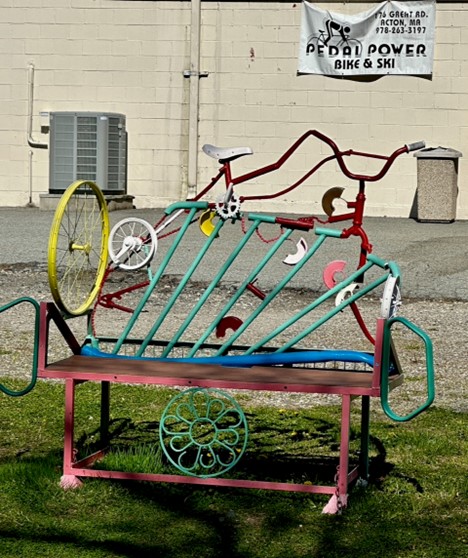 A fun, colorful, bench on the Bruce Freeman Rail Trail. The bench is maide of scrap metal, including a number of old bicycle parts.