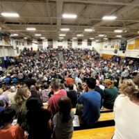 The AB upper gym is packed with voters for the first night of Town Meeting.