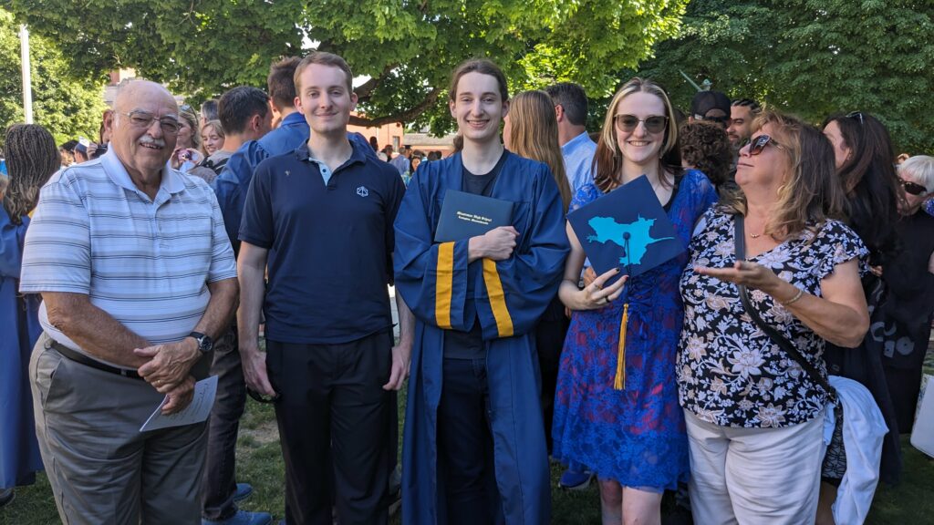 A new Minutman Tech graduate poses with his brother, sister, and one set of proud grandparents.