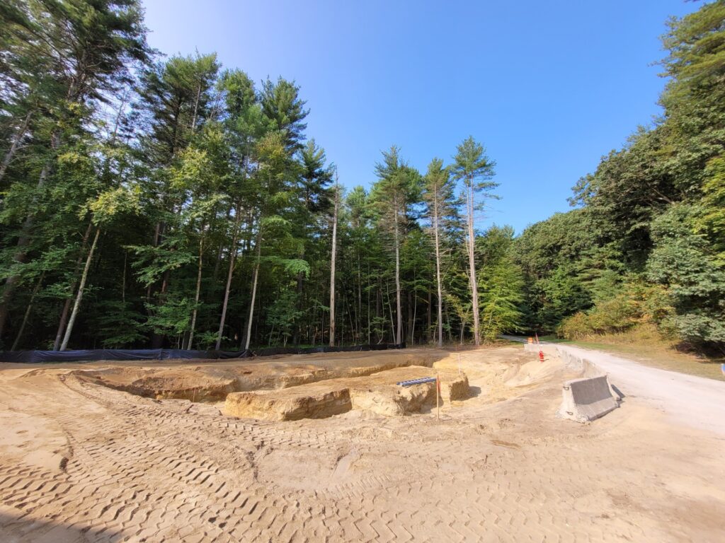 A sandy construction site. In this image, it looks like a sand pit (with no equipment).