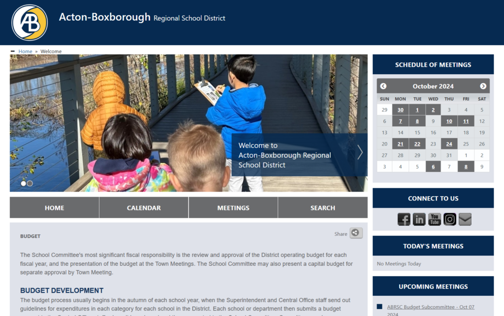 A screenshot of the new AB School Committee website showing a picture of kids on the boardwalk, the October calendar, links to connect to social media, and more information.