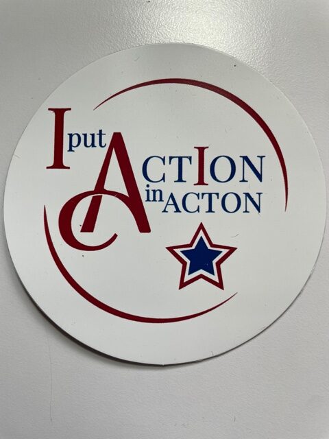 A circular magnet that reads "I put ActIon in Acton."