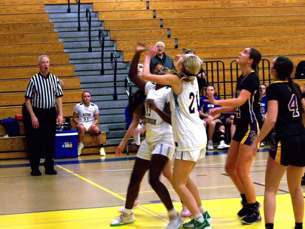 Two AB girls are watching a ball that just headed skywards.