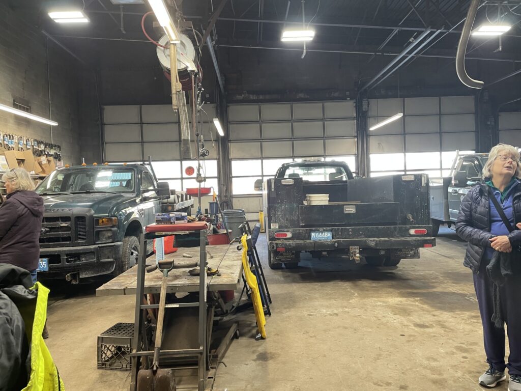 A large garage. You can see two of the three bays, both of which have Acton trucks in them.